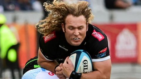 Werner Kok is tackled while playing for Sharks against Bulls in June