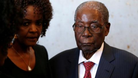 Robert Mugabe with his wife Grace (left)