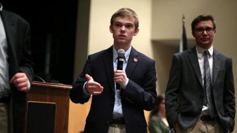 Tyler Ruzich (C), 17, of Prairie Village, Kansas, speaks at a forum.