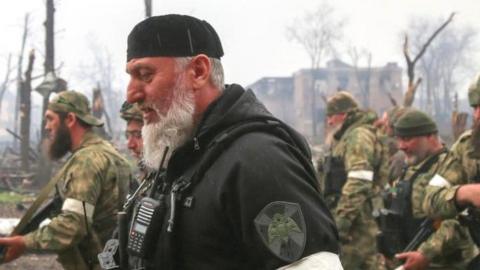 Fighters of the Chechen special forces unit, led by Russia's State Duma member Adam Delimkhanov, walk near the administration building of Azovstal Iron and Steel Works during Ukraine-Russia conflict in the southern port city of Mariupol, Ukraine April 21, 2022