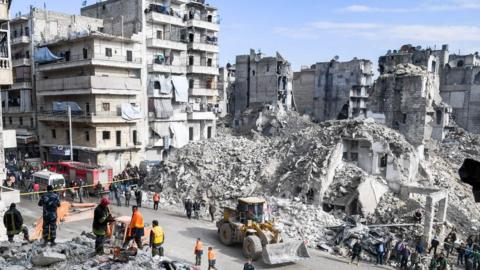 collapsed building in Aleppo