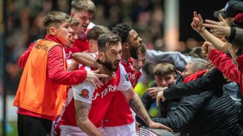 Ollie Palmer celebrates after scoring for Wrexham