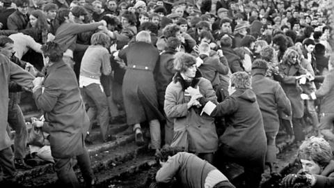 People fighting on terrace