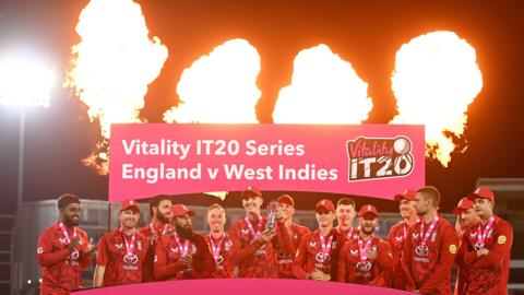 England celebrate and lift the trophy after winning the T20I series against West Indies