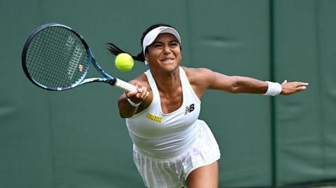 Heather Watson stretches to try and connect with a forehand