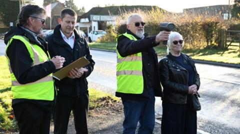 Members of Staverton Community Speedwatch demonstrating the new equipment.
