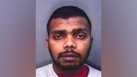 A police mugshot of Anthony Anantharajah