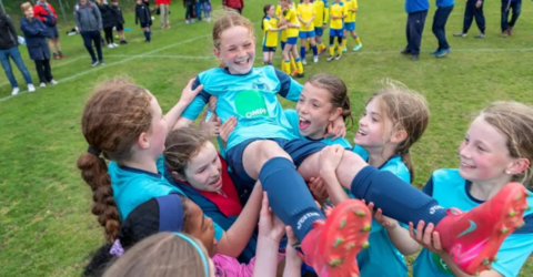 The girls team celebrating 