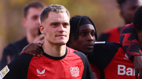 Florian Wirtz looks at the crowd after a game for Bayer Leverkusen