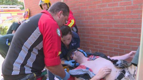 Darren Crumpler being given medical attention