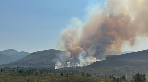 smoke over the hills