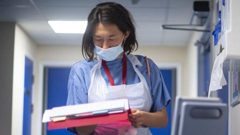 Hospital staff looking a notes