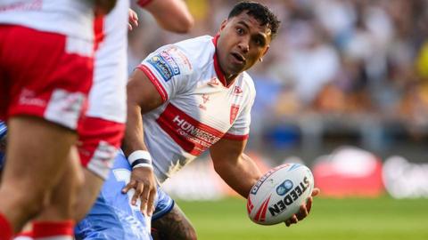 Hull KR's Tevita Pangai Junior holds the ball in his left hand in action against Leeds Rhinos in June.