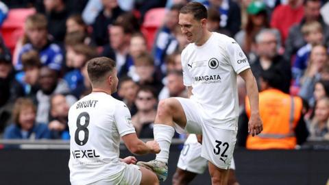 Matt Rush of Boreham Wood celebrates scoring his team's first goal with teammate Zak Brunt