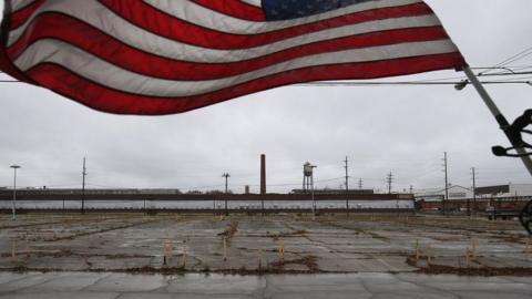 An overgrown parking lot lies empty in front of the closed Packard Electric complex on October 29, 2012 in Warren, Ohio.