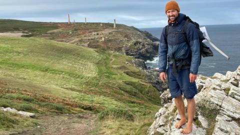 Ben Tidy standing on a rock