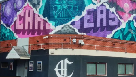 The colourful pink, purple and turquoise front of the Chasers nightclub building in Kingswood