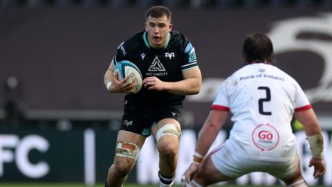 Morgan Morse of Ospreys is challenged by John Andrew of Ulster