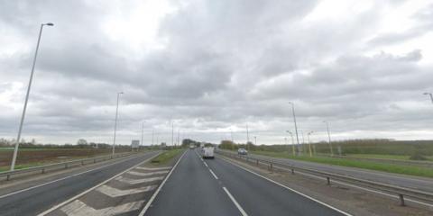 A stretch of dual carriageway with chevrons.