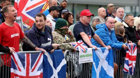 Anti-migrant protesters demonstrate outside the Cladhan Hotel on September 07, 2025 in Falkirk, Scotland.