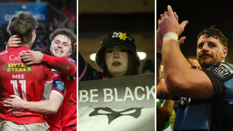 Scarlets players celebrate, as Ospreys fan with a protest banner and Alun Lawrence of Cardiff applauding fans