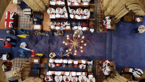 View from above at St Paul's church, Rusthall, Kent, where poppies were scattered during the service in 2023