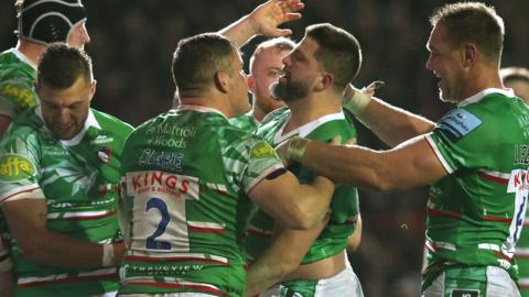 Leicester Tigers players celebrate a try against Northampton