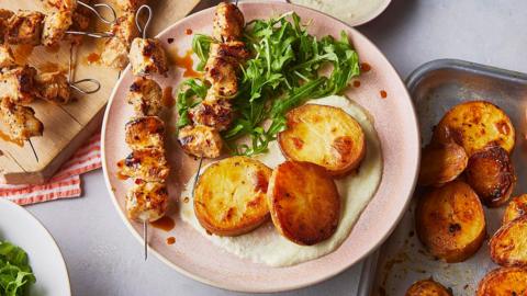 Chicken skewers with lemon-roasted potatoes and whipped feta