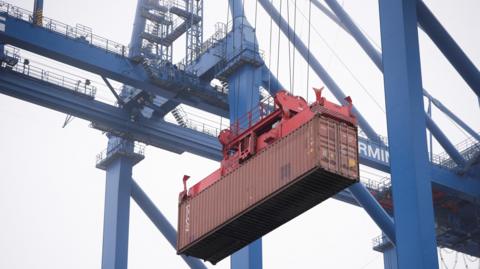 A crane moves a container at the new megaport being built by China's state-owned Cosco Shipping in Chancay, Peru