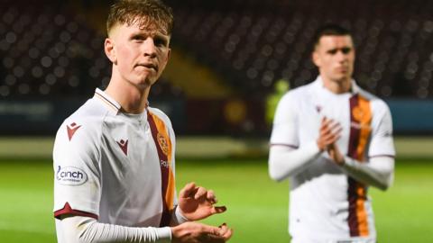 Motherwell players clap crowd