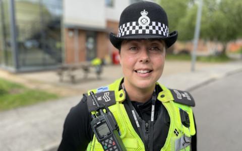 Sgt Gemma Rutter wearing police uniform and standing in front of Trowbridge Police Station