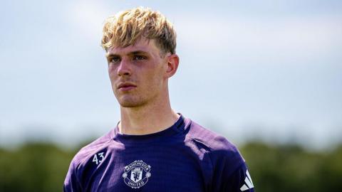 Manchester United midfielder Toby Collyer is in his purple training kit taking part in a session