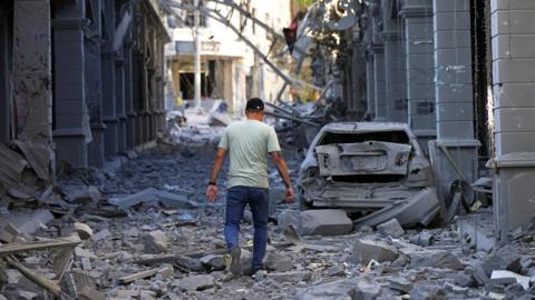 A man walks amidst rubble in the aftermath of Israeli strikes in Nabatieh, Lebanon, June 15, 2026. 