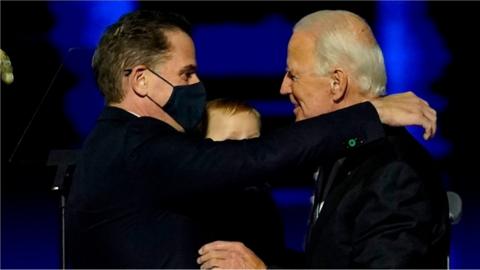 Joe Biden embraces his son Hunter Biden after addressing the nation from the Chase Center 7 November 2020 in Wilmington, Delaware.