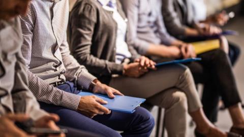 interviewees in a waiting room