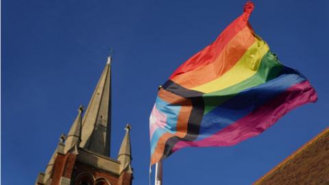 A pride flag outside a church in Suffolk