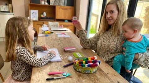 Annie Ridout and two of her young children who are off school