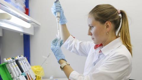 A handout photo made available by the Russian Direct Investment Fund (RDIF) shows a scientist of Nikolai Gamaleya National Center of Epidemiology and Microbiology working on the production of a new two-vector COVID-19 vaccine in Moscow, Russia, 6 August