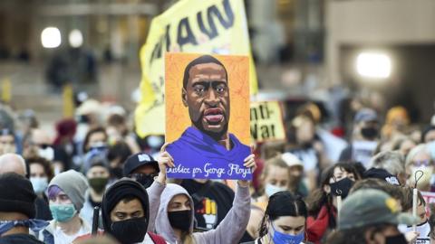 Protesters march through downtown Minneapolis on the first day of opening statements for the murder trial of former Minneapolis police officer Derek Chauvin who was charged in the death of George Floyd, in Minneapolis, Minnesota, USA, 29 March 2021.