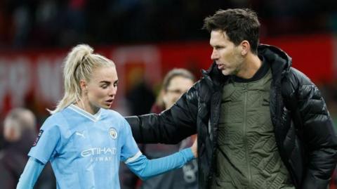 Alex Greenwood talking to Gareth Taylor on the pitch