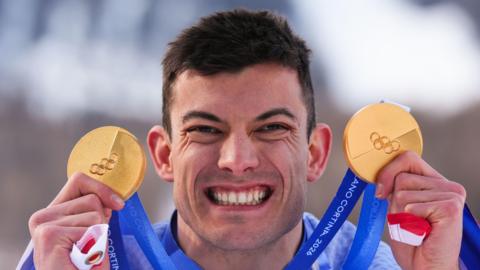 Great Britain's Matt Weston with his two gold medals
