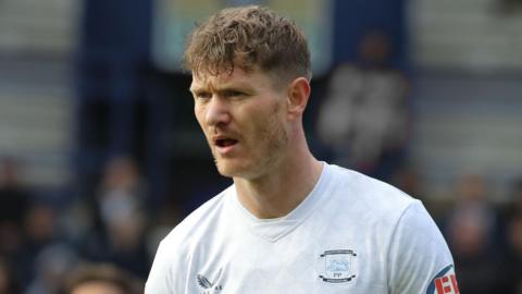 Michael Smith, wearing Preston North End's white home shirt, pictured during a Championship game against Norwich City at Deepdale in December 2025