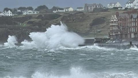 Very rough seas with a waves crashing on Peel Promenade.