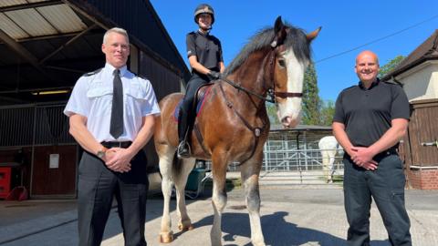 Assistant Chief Constable Richard Robertshaw stands next to PC Cassie Barratt, riding PH Lawson, with Inspector Tim Coussens 