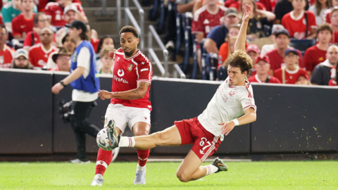 Liverpool's Lewis Koumas battles for the ball against Wrexham's Zak Vyner