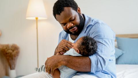 Father looking after his child.