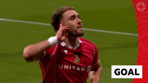 Sam Smith celebrates his goal against Chelsea with one hand cupped beside his ear