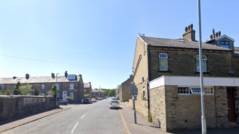 A street in Halifax lined with stone-built houses.