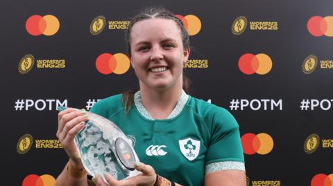 Brittany Hogan with her player of the match award