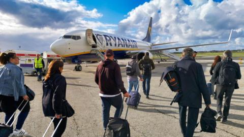 Ryanair passengers boarding a B737 airplane at Malta International Airport, Luqa.